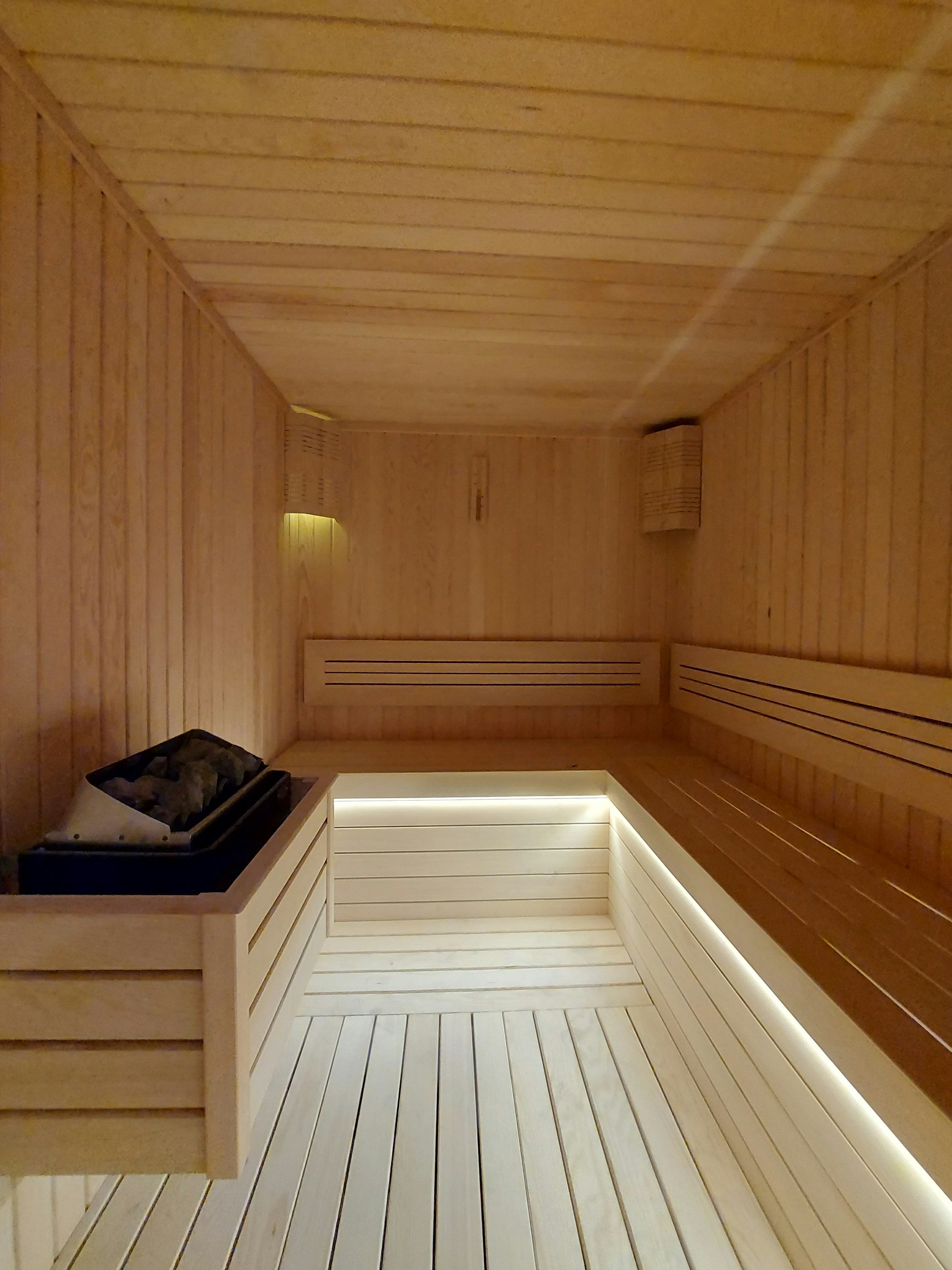 Clean, well-maintained wooden sauna interior